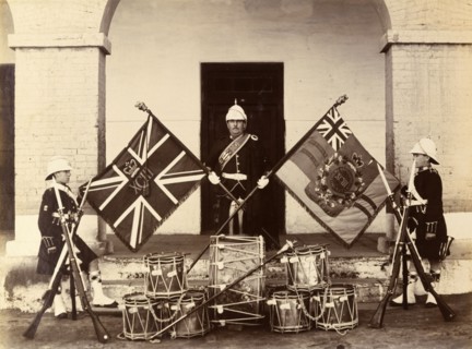 Colours of the 93rd Highlanders. Three uniformed soldiers from the 93rd Highlanders pose proudly