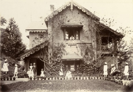 The Blount family at Roseneath. Pakistani servants dressed in white tend to the Blount family as