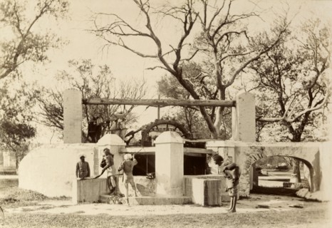 An Indian 'bheesti' visits the well. An Indian 'bheesti' or water carrier hauls a heavy bag of