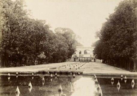 Fountains in the Shalimar Gardens. Long lines of trees surround a series of shallow canals fitted