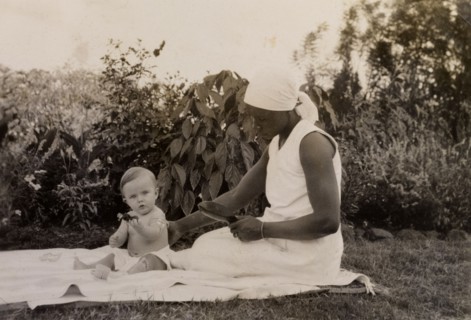 Gwynneth at seven months. An African ayah (nursemaid) identified as 'Salima' supports a seven month