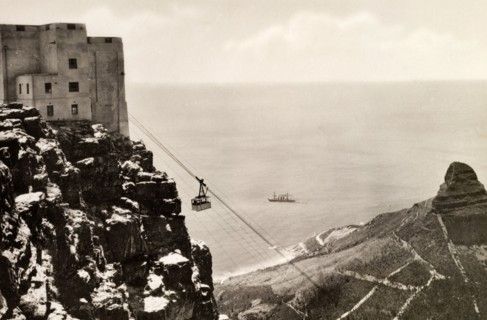 Cablecar at Table Mountain. A cablecar en route at Table Mountain. The famous Lion's Head mountain