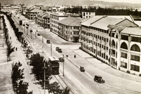 Seafront parade at Durban. Cars and trams are dotted along Durban's wide, open seafront parade.