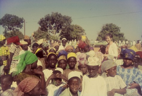 Celebrating the end of Ramadan. Nigerian children in traditional dress peer curiously into the