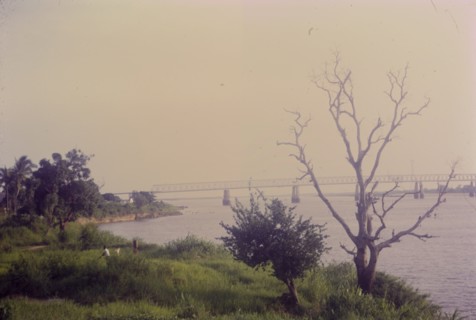 Damaged Kennedy Bridge. View of the John F. Kennedy Bridge spanning the River Niger. A section of