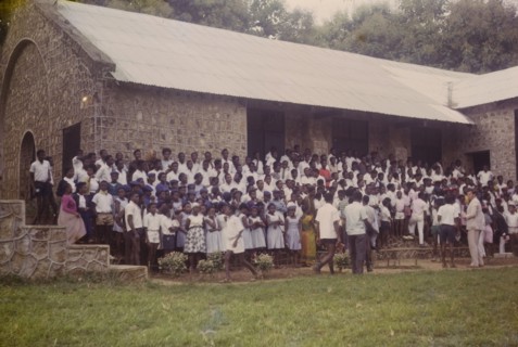 Student union rally. Uniformed students line up for a student union rally outside a Church of