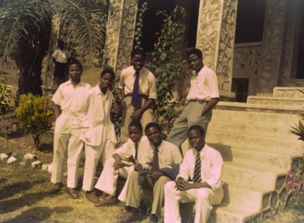 Church of Nigeria prefects. A group of smartly dressed prefects sit on the steps outside a Church