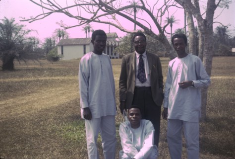 Canon Falofe with catechists. Outdoors portrait of Canon Falofe, a Church of Nigeria priest, with