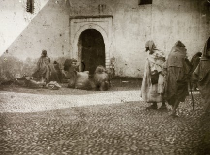 Street traders, Casablanca. Street traders attempt to catch passing trade on a cobbled street in