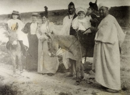 The Russi children on a donkey ride. A European governess and two Moroccan servants accompany Mrs