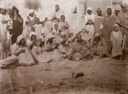 Storytelling at Safi. A 'halca' (audience) of Moroccan locals watches intently as a 'halaiqui'