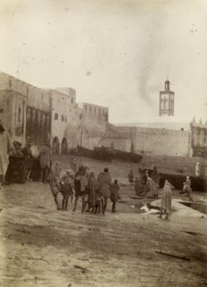 Harbourside market place, Safi. Morrocan people mill about at a market place near the harbour in