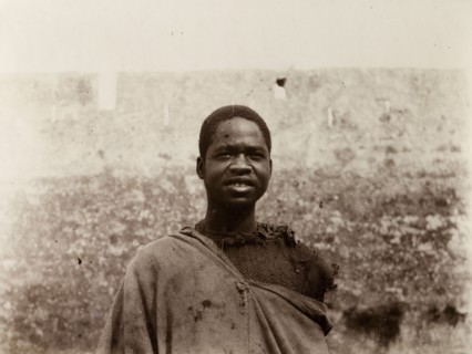 Labourer in Safi, Morocco. Outdoors portrait of a sub-Saharan African man in ragged clothing. A