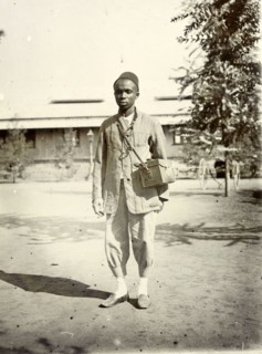 Frederick Stanbury's domestic servant. Stanbury's servant is an unidentified young African man. He