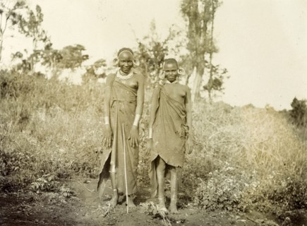 Two Kikuyu women. Two young Kikuyu women wearing traditional dress and masses of hooped earrings,