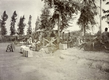 Frederick Stanbury's porters. Frederick Stanbury's safari porters wait by a roadside with numerous