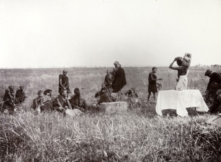 Frederick Stanbury's porters. Frederick Stanbury's porters unload luggage to set up camp on a