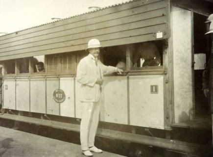 Colonel Will' at Kisumu. A European man identifed as 'Colonel Will' rests his hand on a bar running