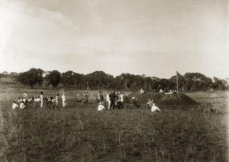 Firing point annual meeting. A group of European men accompanied by their African servants, take