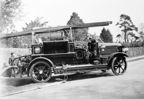 Lymington Fire Brigade. A stencilled sign on the ladder of this open-topped fire engine identifies