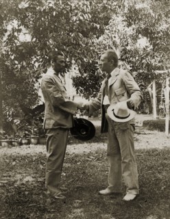 Directors of Anglo-Siamese Boundary Demarcation shake hands. Phya Suntara, Siamese Commissioner,