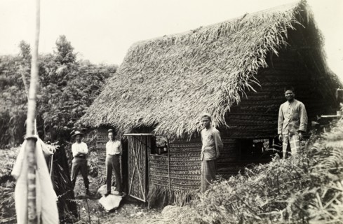 British surveying team at Bukit Asa. British surveyors and their Malay assistants at a thatched