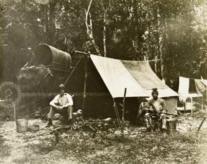 British survey camp. Trigonometrical survey camp of a British surveyor and his Malayan assistant.