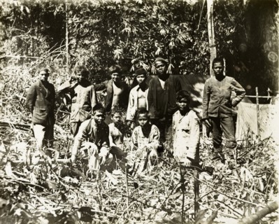 Malay assistant surveyors and porters. Malay assistant surveyors and porters from a British-led