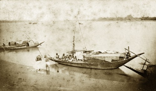 Fishing boats near Chandernagore. A small fishing boat, manned by a crew of four, waits for the off