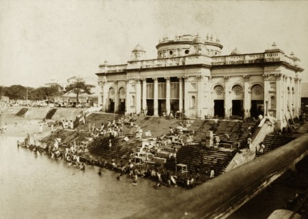 Bathing ghat on the Hooghly River. Hindu devotees bathe at a ghat (stepped wharf) on the banks of
