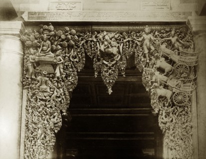Wood carving at Shwe Dagon Pagoda. Detail of an elaborate wood carving at the main entrance to the