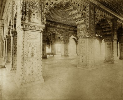 Archways at the Delhi Fort. Ornate archways decorated with painted designs stretch along a corridor