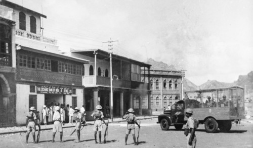 Armed police during the Arab riots in Aden, 1947. Armed police climb out of an armoured vehicle and