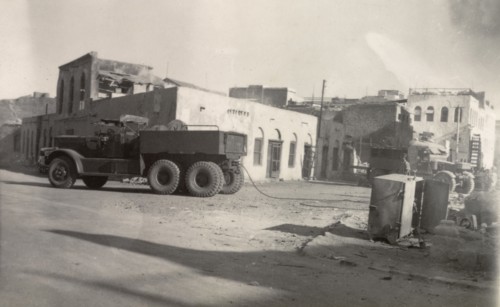 Aftermath of Arab riots in Aden, 1947. An army truck with a trailing tow rope is parked near