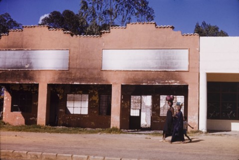Commercial building damaged in riots, Elizabethville. A burnt and gutted commercial building in