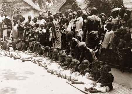 Children's festival, Nigeria. A line of young children wait to perform a traditional dance at a