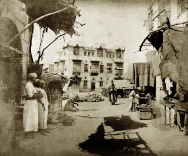 Street scene in Suakin. Street traders sell their wares at a market in the centre of town. Suakin,