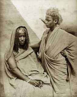 Bischarin women. Portrait of two Bisharin women, their hair worn in traditional style. Sudan, North