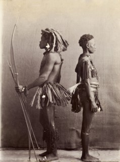 Andaman Islanders. A man and a woman from the Andaman Islands stand, back to back in profile,