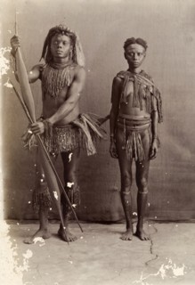 Couple from the Andaman Islands. A man and a woman from the Andaman Islands stand, facing the