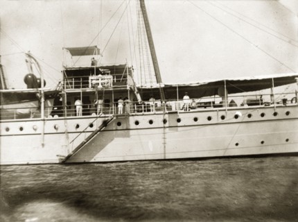 Waving goodbye. Officers aboard RIMS 'Investigator' wave goodbye to G.E. Wood (the photographer and