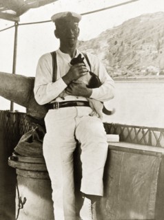 Gunner aboard 'Karanja'. Mr Harknet', a gunner aboard the armed launch boat 'Karanja', holds a