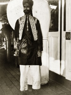 A workshop labourer all dressed up. A workshop labourer dressed in his finest clothes aboard a