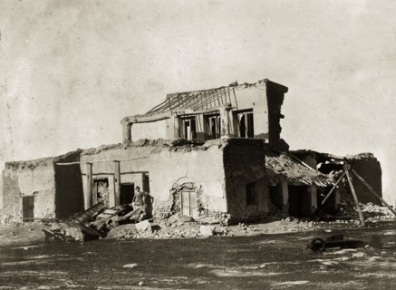 Remains of the hospital at Basidu. A European man identified as 'Lieutenant Poyntz' poses amidst