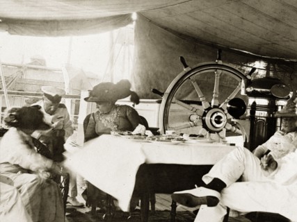 Taking tea aboard RIMS 'Minto'. Mrs and Miss McAlpin take tea with senior naval officers aboard