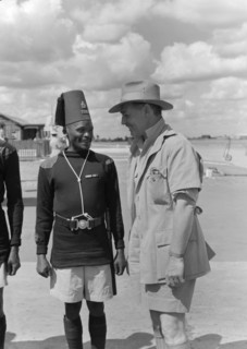 Clarke Gable jokes with an askari. Hollywood film star Clarke Gable jokes with a uniformed askari