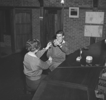 Jean and John raise a toast. A couple identified as 'Jean and John' raise their glasses in a toast