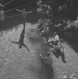 Dance rehearsal, Kenya. The long shadow of a ballet dancer, arms outstretched, extends across a