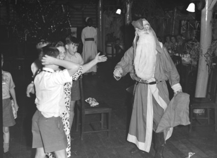 Father Christmas visits. Father Christmas visits a children's Christmas party at the Forest Inn.