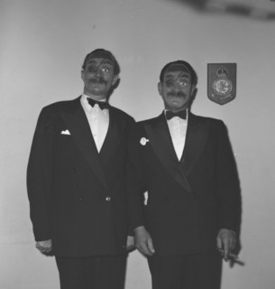 Eric Mathers and Cecil'. Two suited men identified as 'Eric Mathers and Cecil' pose for the camera